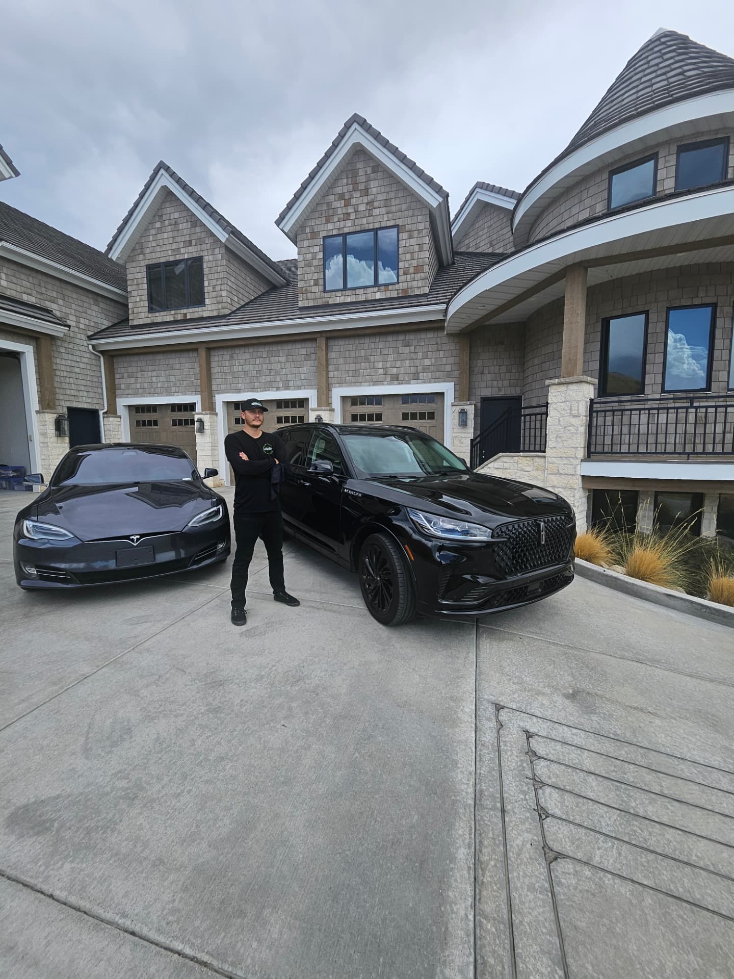 Conner detailing two vehicles at a Utah County home